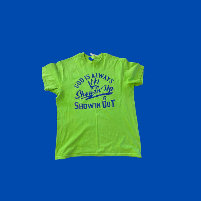 Bright neon green t-shirt featuring the text "God is always ready to show up and show out" prominently displayed.
