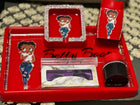 Full Black Betty Boop Trey Set  bundle featuring matching tray, shot glass, canister, and rhinestone ashtray with image in center,colors are Red with black writing on trey and tote bag only, 2 toned Red & Black shot glass with image and strip of clear rhinestone in the middle forming a circle,with Black Betty Boop image,Red Twist Top Canister with Image laid out