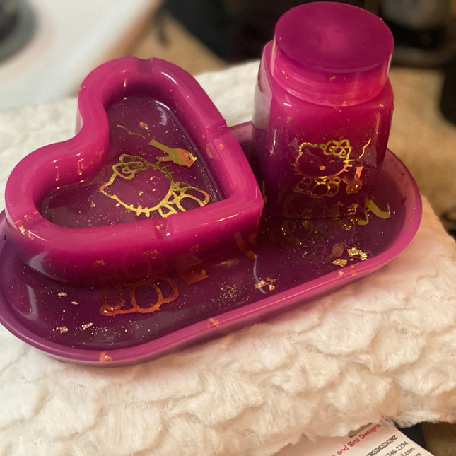 “Pink and purple ombré Hello Kitty oval tray with gold flakes and gold Hello Kitty character decal, 7x3 size, top view.”