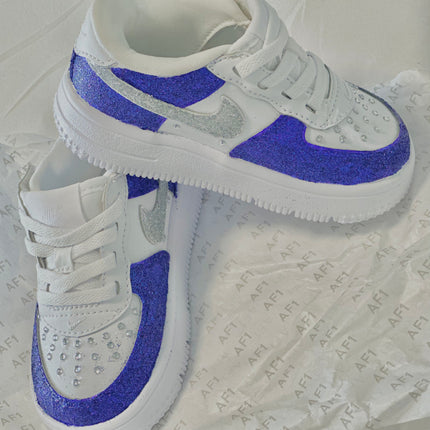 Cute custom painted kids shoes with glitter accents and fun cartoon-inspired details